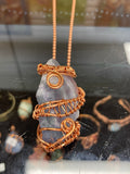 Fluorite crystal wrapped with copper